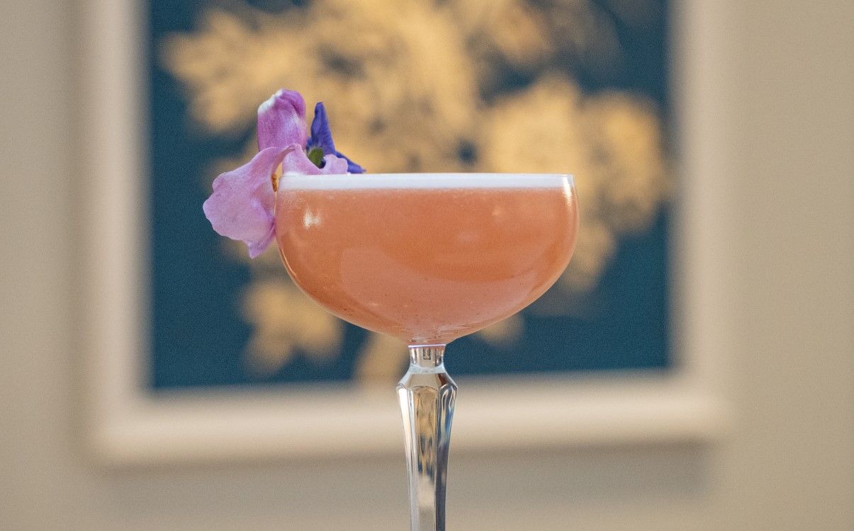 Pink cocktail with flowers in The Atrium Lounge